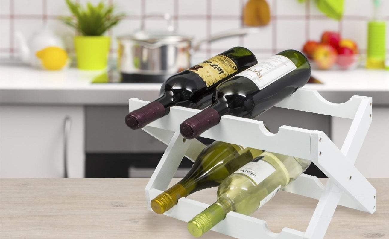 the rack in white holding bottles of wine