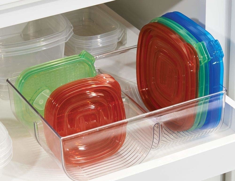 the organizer holding various sizes of container lids