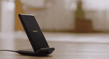 Gif of phone being placed on wireless charger and charging