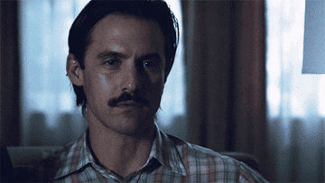 Gif of Milo Ventimiglia on the TV show &quot;This Is Us&quot; lifting a &#x27;World&#x27;s Best Dad&quot; mug to his mouth