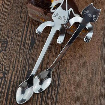 Two cat-shaped stirring spoons