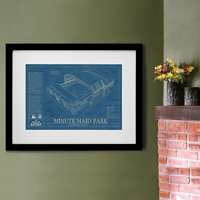 Art print of Minute Maid Park on a wall next to a fireplace mantle