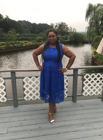 Reviewer wearing the thick-strap lace dress in blue.