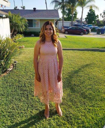 A different reviewer wearing the dress in light pink. 