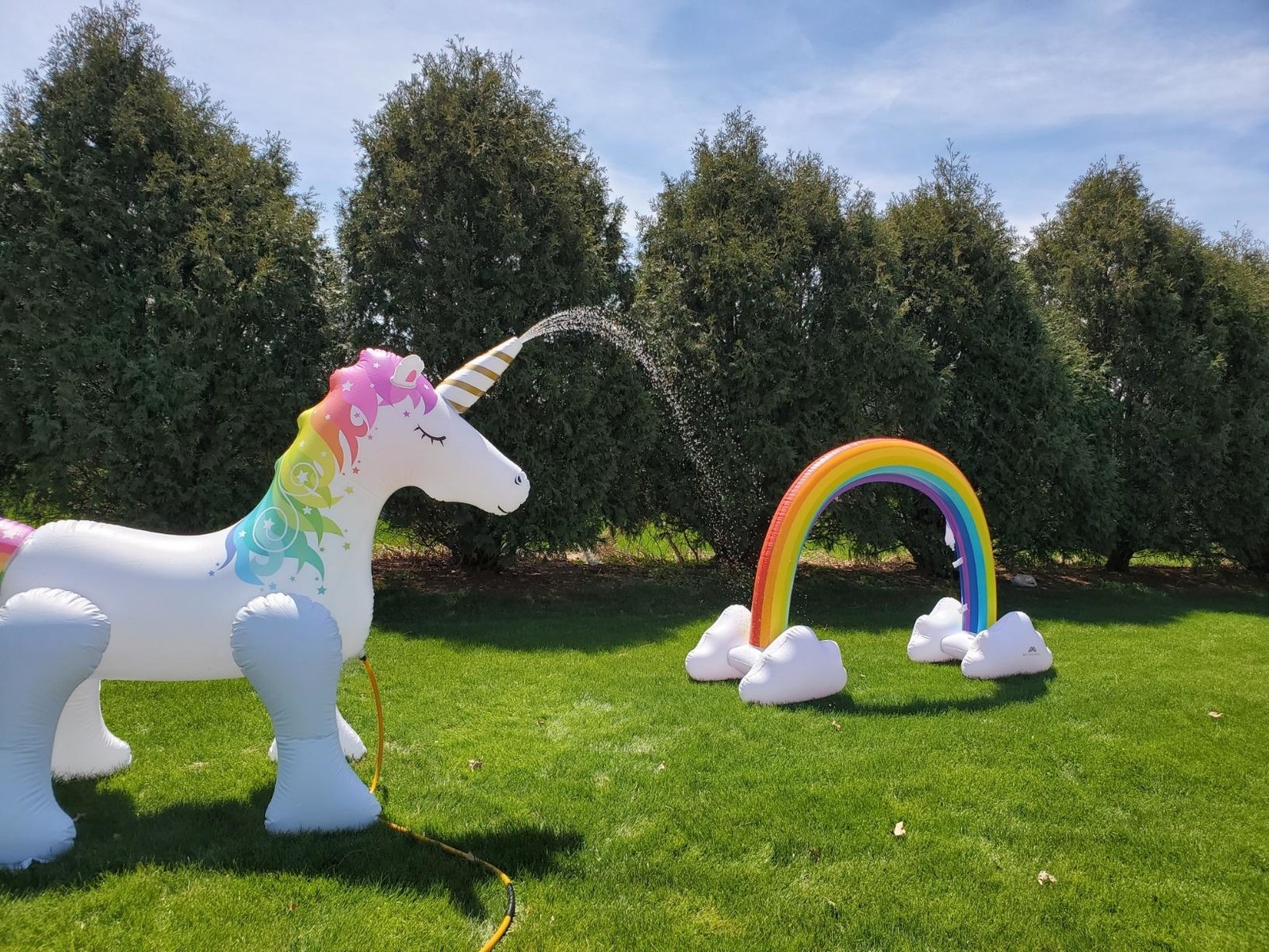 large inflatable unicorn that shoots water out of horn