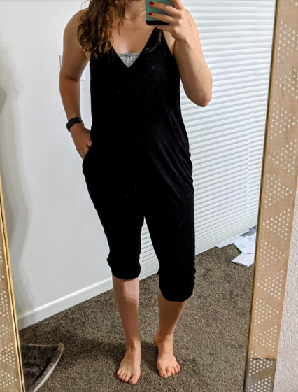 A reviewer wearing the v-neck, spaghetti strap jumpsuit