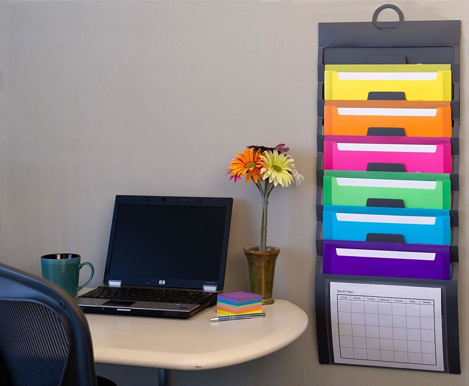 The hanging folder on a wall behind a desk