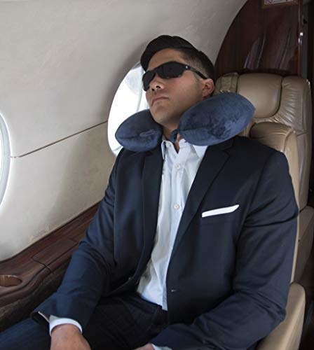 person sleeping on a plane wearing the sunglasses