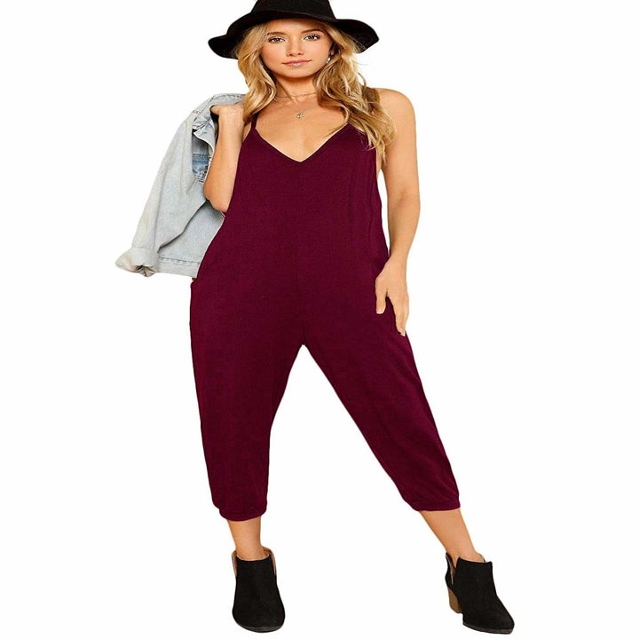 A model wearing the calf-length jumpsuit in burgundy
