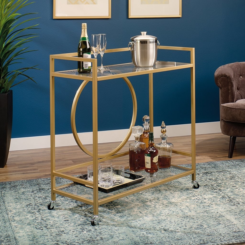 gold bar cart with geometric piping details and wheels