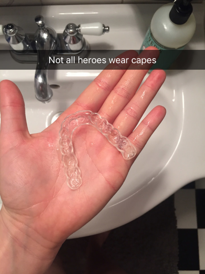 BuzzFeed editor&#x27;s hand with mouth guard on it with caption &quot;not all heroes wear capes&quot;