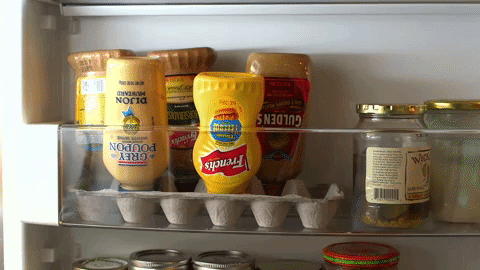 No furiously banging the mustard against your palm, trying to force the last tablespoon of it down to the end where you can actually use it. From Alton Brown's YouTube; here are all of his best cooking hacks!