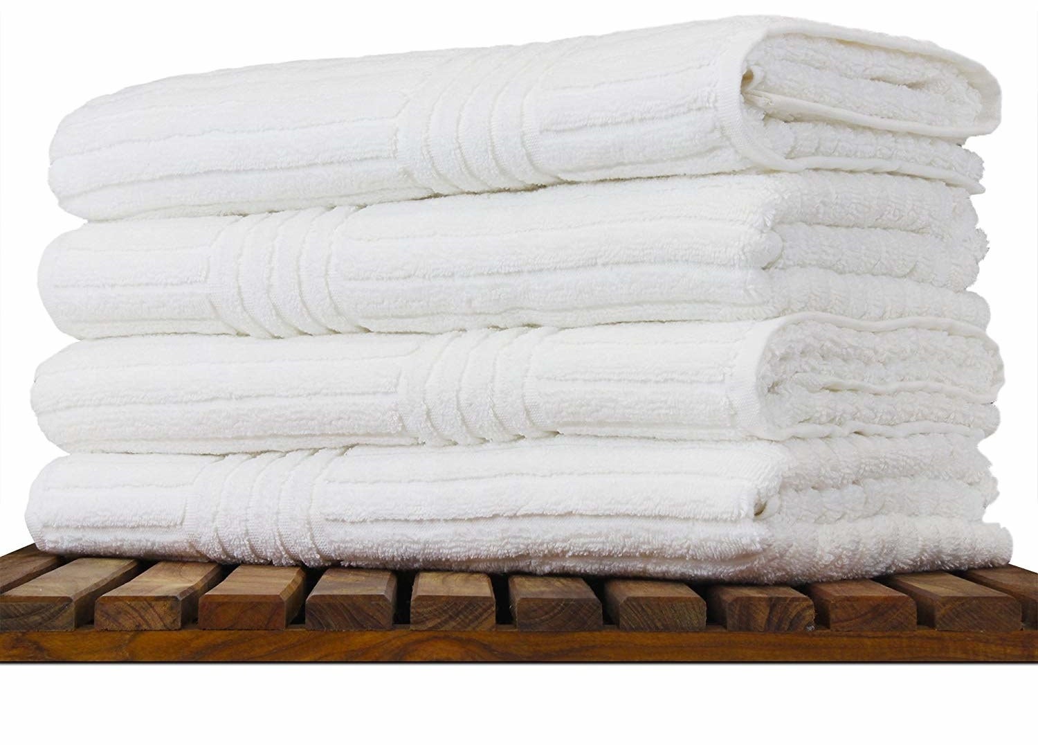 The stack of white textured towels