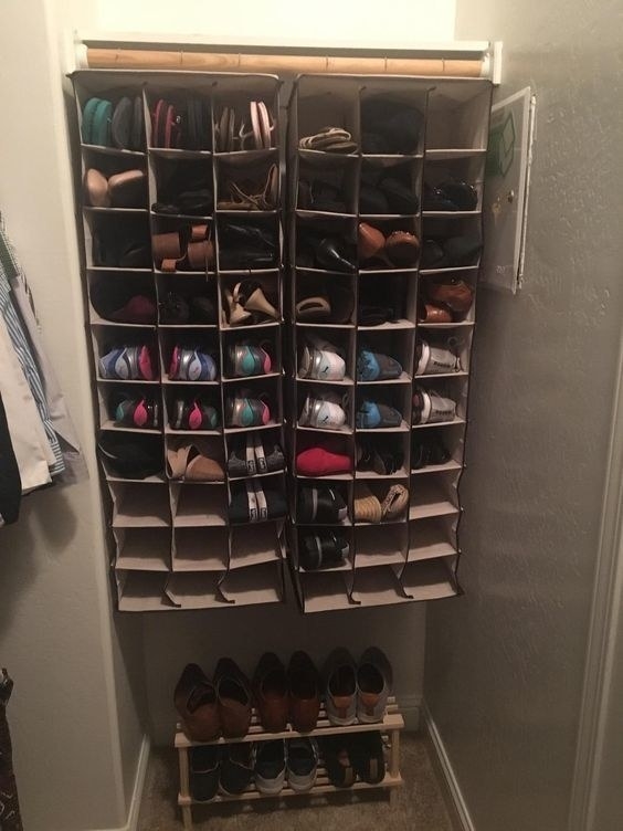 A reviewer using two of the organizers to organize their sneakers and shoes