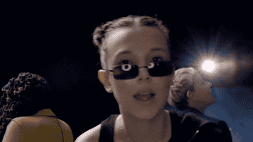 Millie Bobby Brown Plays With Puppies While Answering Fan Questions