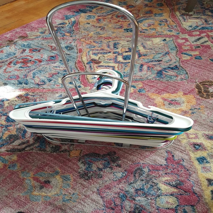 the same hangers stacked neatly on the metal hanger stacker