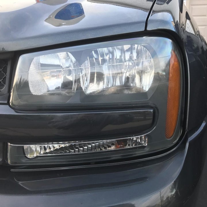 the same car headlight cleaned and clear
