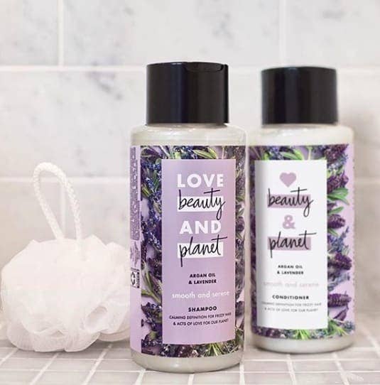 a two set of shampoo and conditioner with lavender floral decor on the bottles