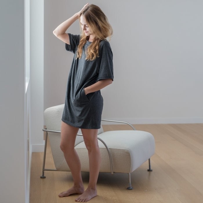 a model wearing the sleep shirt in grey with their hand in the pocket