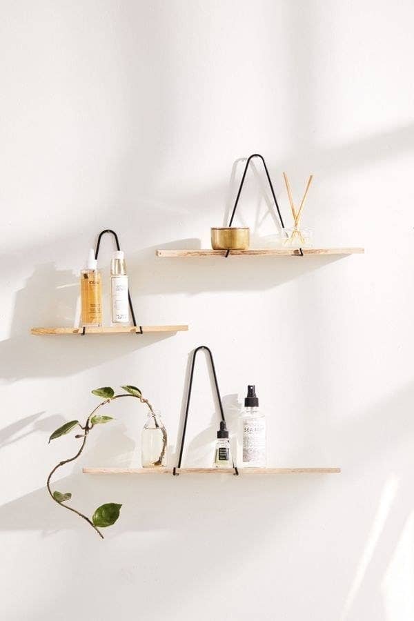 Triangle bracket wall shelves in three sizes hanging on the wall