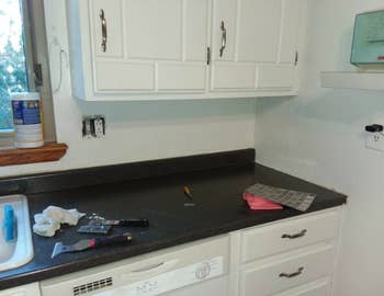 Before picture of kitchen counter with empty backsplash