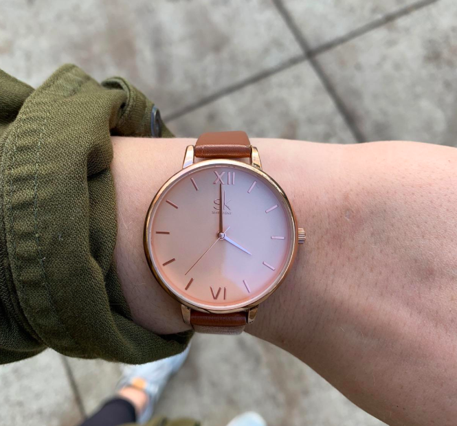 A different reviewer wearing the watch but in rose gold with brown straps