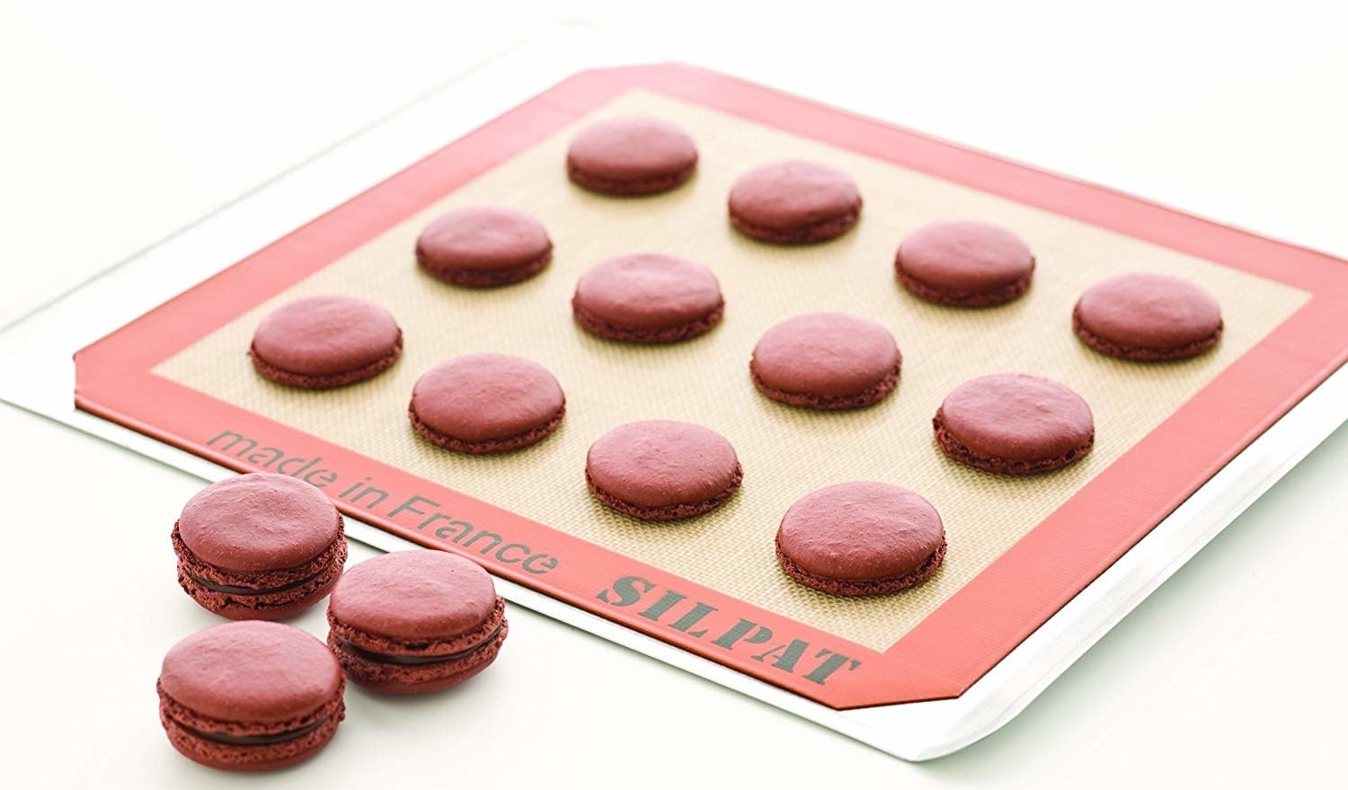 A batch of macarons on the baking mat