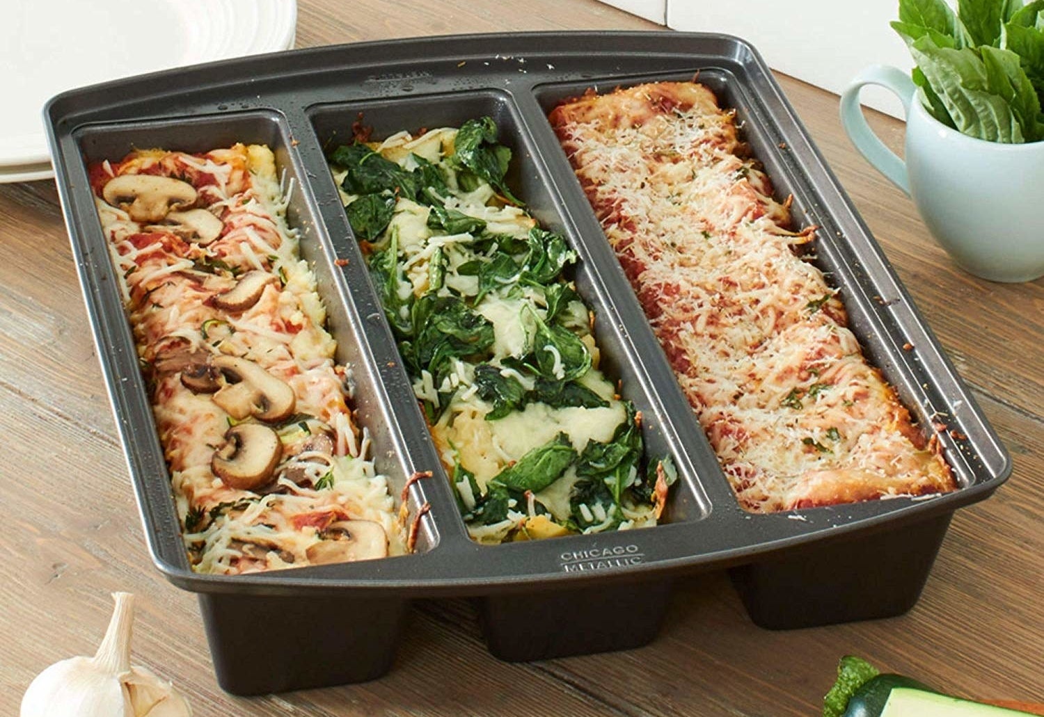 The lasagna trio pan with three different types of lasagna in it