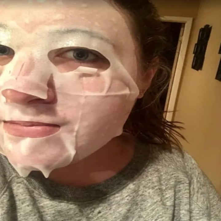 BuzzFeed Editor Samantha Wieder wearing one of the collagen essence sheet masks