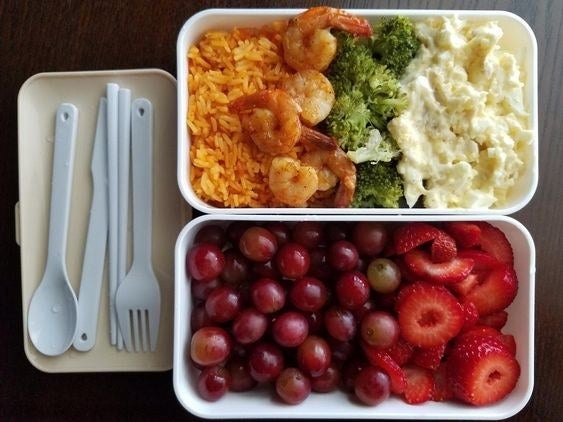 reviewer photo showing two bento boxes filled with fresh fruit and a homecooked meal 