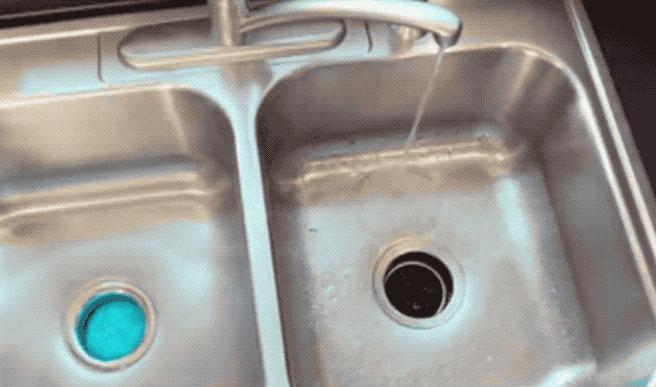 gif of blue foam overflowing from garbage disposal 