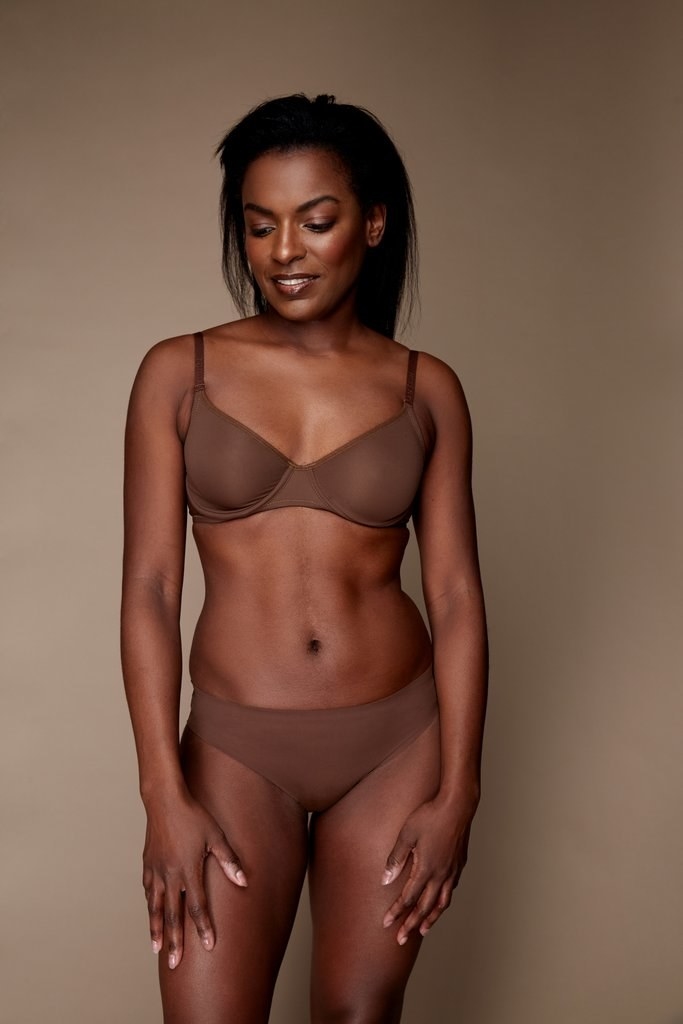 Model wearing brown bra and panty set