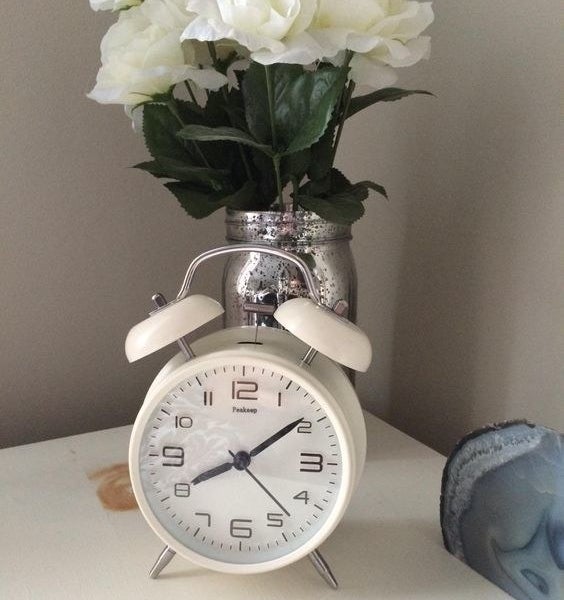 Reviewer&#x27;s picture of the white alarm clock with two bells