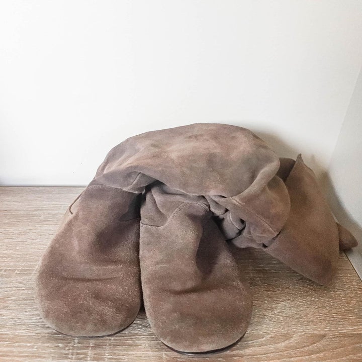 reviewer photo showing a pair of their boots slumped over