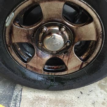 a dirty grimy car wheel
