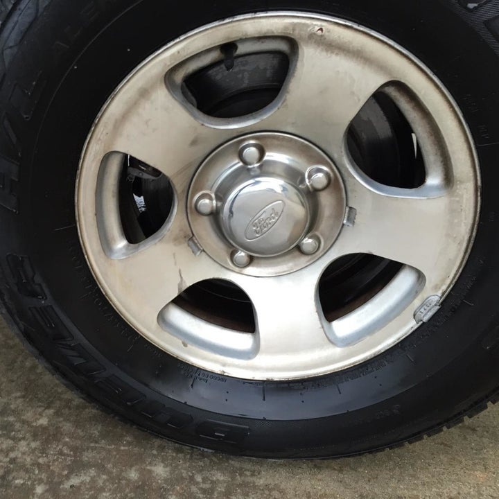 same reviewer showing the same hubcap completely cleaned after using the wheel cleaner 