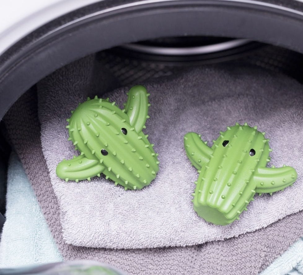 The cactus-shaped balls on a pile of towels