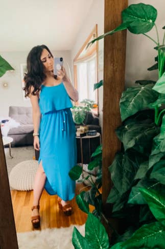 Another reviewer wearing the dress in a bright sky blue 