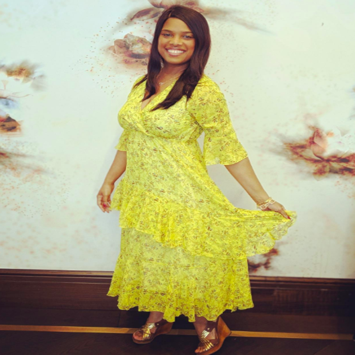 A reviewer wearing the 3/4-sleeve dress in yellow