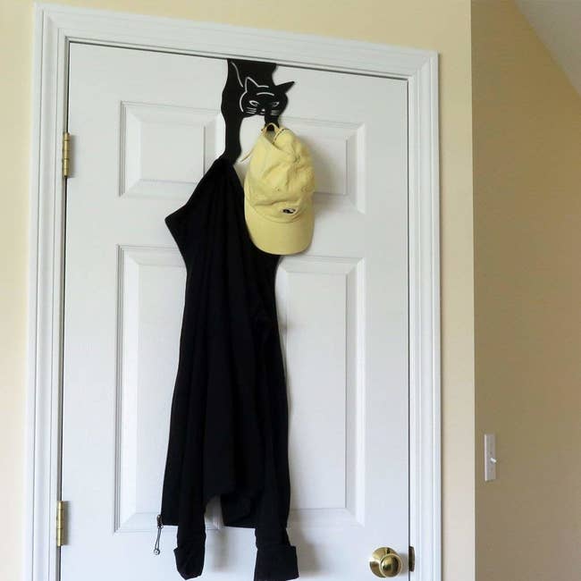 The over-the-door hook shaped like a black cat