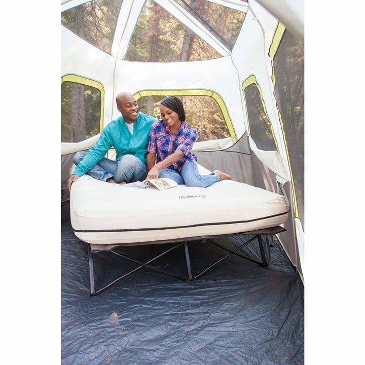 models on an inflatable Coleman mattress on a stand