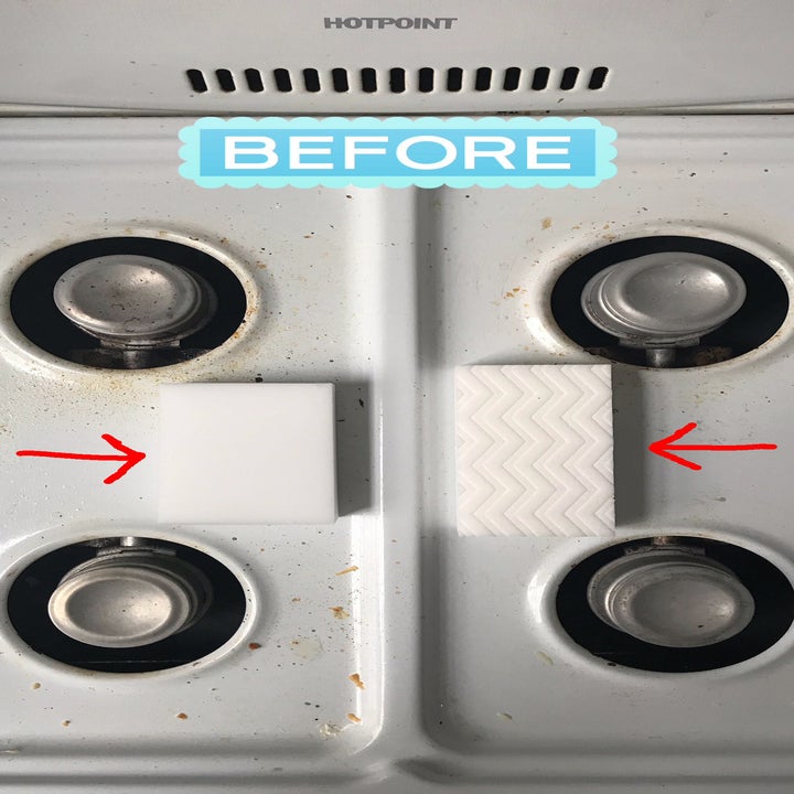 a dirty stove before being cleaned with a melamine sponge