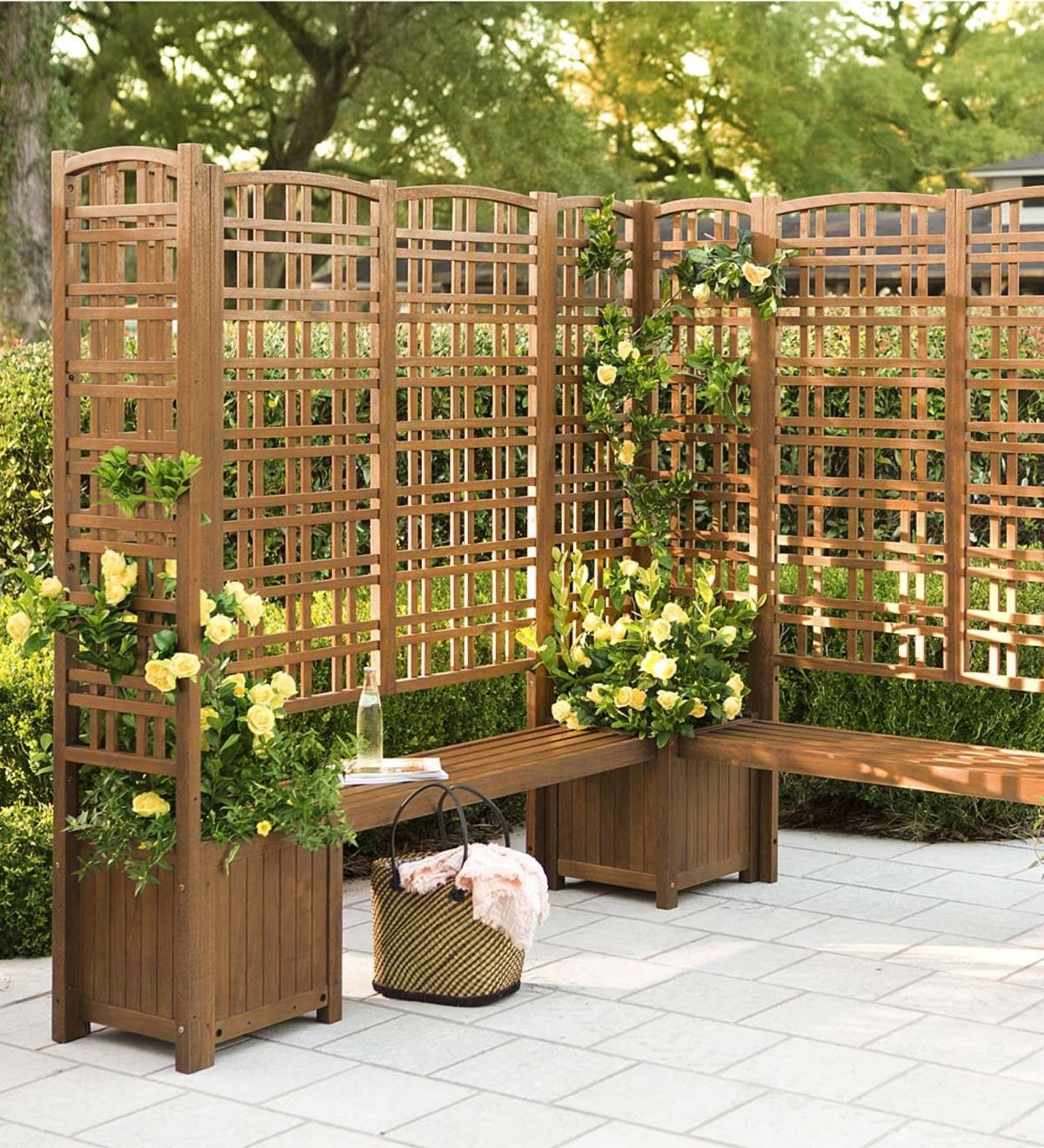 the wooden privacy screen planters on a patio