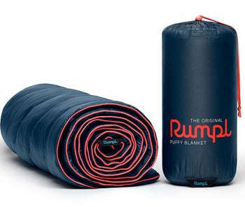 blanket rolled up next to its carrying bag