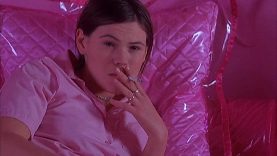 Clea Duvall smoking a cigarette in a scene