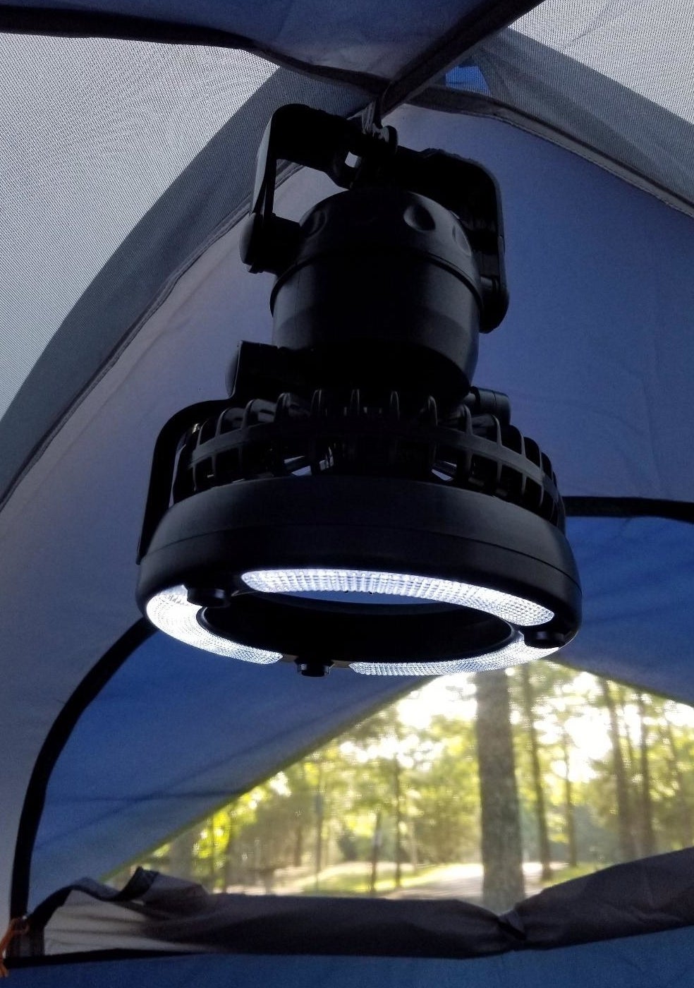 the light and fan combo hanging in a reviewer&#x27;s tent
