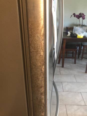 Reviewer photo showing sticky residue on fridge door