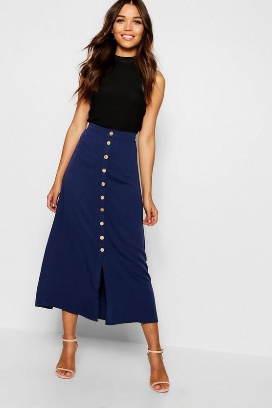 a model wearing the skirt in navy blue