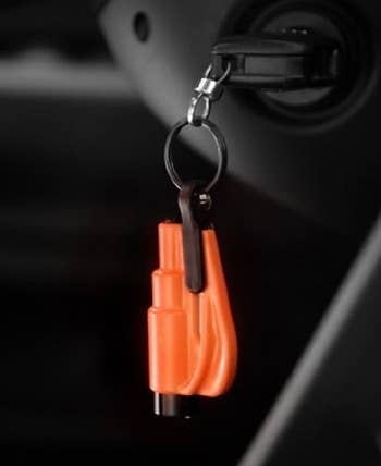 Car escape tool hanging from keychain