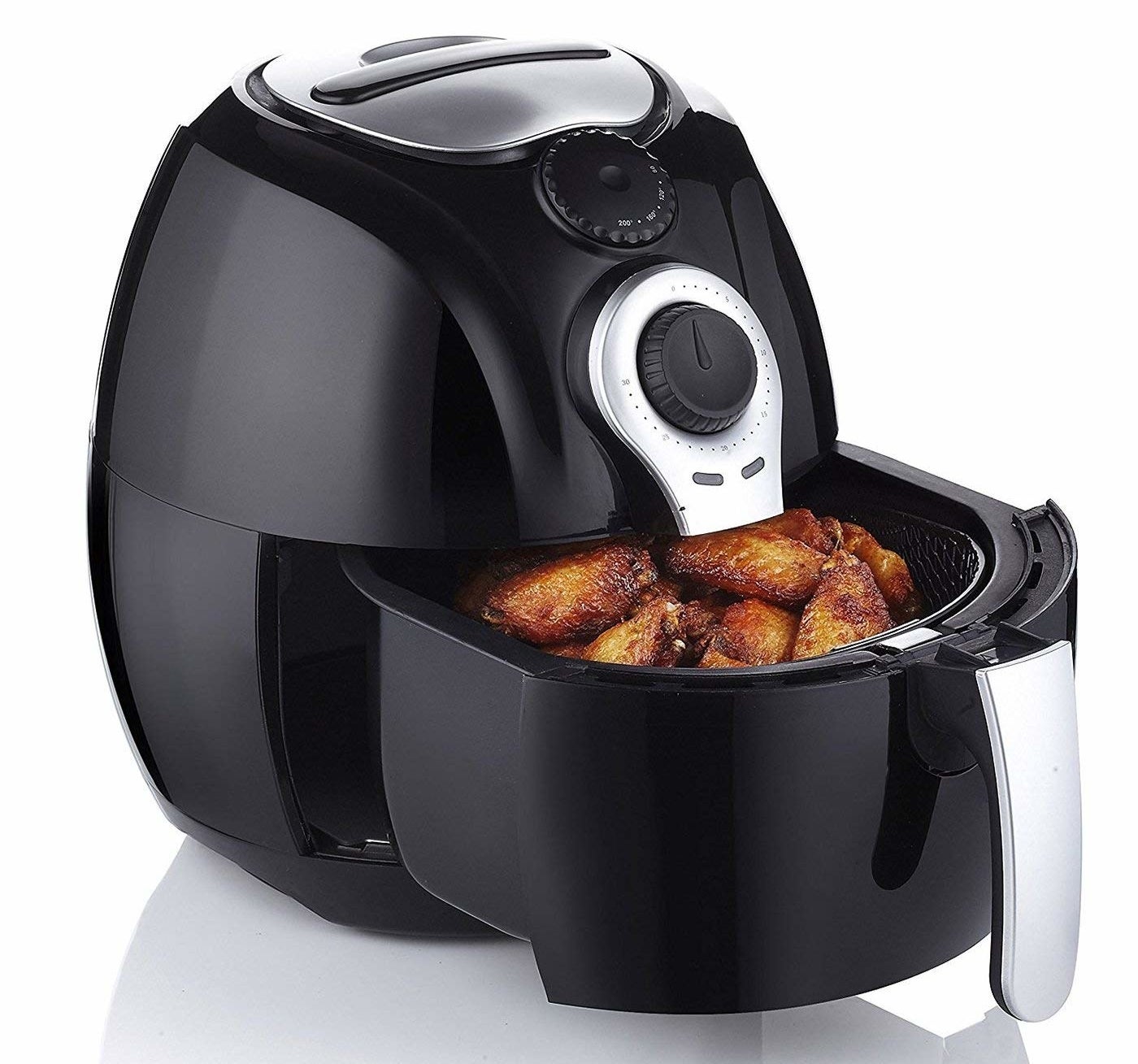 The black air fryer with wings in its pull-out drawer